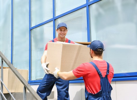 Staff and customers following safety procedures inside a storage facility