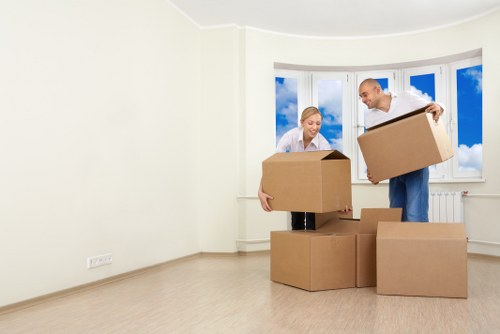 Professional movers carrying boxes during a Hammersmith relocation
