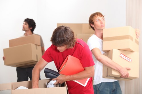 Professional movers handling stairs during a Hammersmith apartment move
