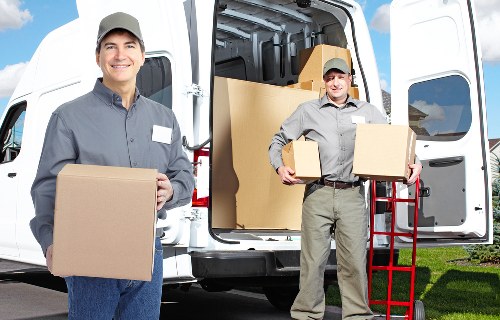 Removals team loading furniture safely on moving day in Hammersmith